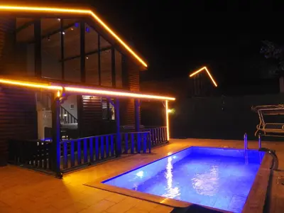 a small swimming pool on a deck at night at SAPANCA FAMİLY RESORT in Kartepe