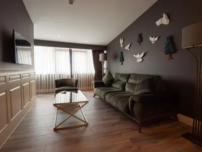 a living room with a couch and a table at Hotel Miniature Istanbul in Istanbul