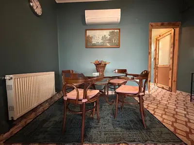 a dining room with a table and chairs at Waterfront Villa by the Tram - Private Terrace with Dome & Golden Horn View in Fatih in Istanbul
