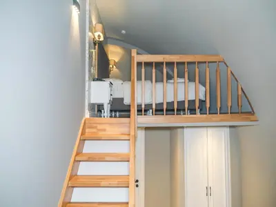 a bunk bed in a room with a ladder at La Vida Ex Palazzo Suit Karaköy in Istanbul
