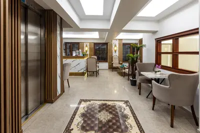 a living room with a table and chairs at LINNGA HOTEL & SUITE in Istanbul