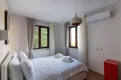 a bedroom with a white bed with towels on it at Bright Loft with 3 bedrooms and terrace in Galata in Istanbul