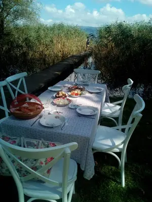 a table with chairs and plates of food on it at Beta Home Sapanca in Sapanca