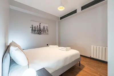 a bedroom with a large white bed in a room at Brand New Duplex wParking 2BD2Bath Home #336 in Istanbul