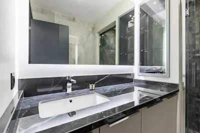 a bathroom with a white sink and a mirror at Brand New Duplex wParking 2BD2Bath Home #336 in Istanbul