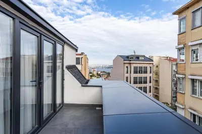 an apartment balcony with a view of the city at Duplex Penthouse wparking 3BD2Bath Views! #340 in Istanbul