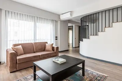 a living room with a couch and a coffee table at Duplex Penthouse wparking 3BD2Bath Views! #340 in Istanbul