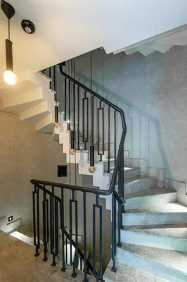 a staircase in a house with a painting on the wall at Cozy Bright wParking 2BD1Bath Central Home!#338 in Istanbul