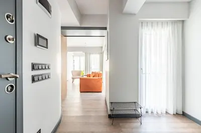 a hallway with a door leading to a living room at Charming Bright New 2BD1Bath Home wparking!#339 in Istanbul