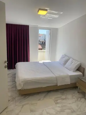 a bedroom with a large bed with a window at yeniKAPI hotel in Istanbul