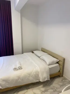a bed with white sheets and pillows in a room at yeniKAPI hotel in Istanbul