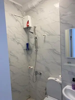 a bathroom with a shower with a toilet and a sink at hotel YENİkapı in Istanbul