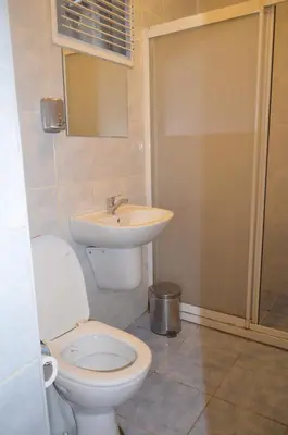 a bathroom with a toilet and a sink at Ekol Hotel in Istanbul