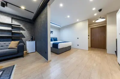 a bedroom with a bed and a staircase at The Business Class Suit Karakoy in Istanbul