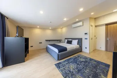 a hotel room with a bed and a television at The Business Class Suit Karakoy in Istanbul