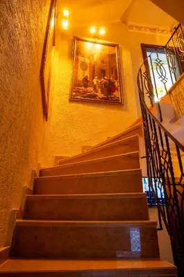 a set of stairs with a picture on the wall at Sayina Hotel in Istanbul