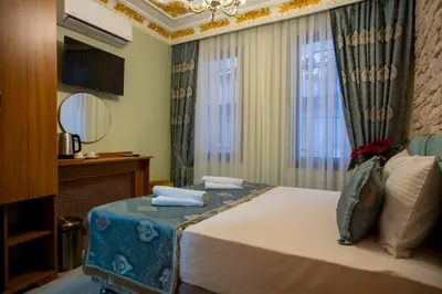 a hotel room with a bed and a window at Sayina Hotel in Istanbul