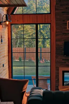 a living room with large windows and a couch at Sapanca Grandwooden in Sakarya
