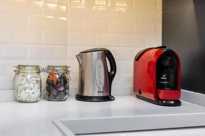 a toaster and two jars on a kitchen counter at G&B MANSION in Istanbul