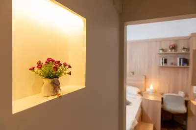 a vase of flowers sitting on a shelf in a room at G&B MANSION in Istanbul