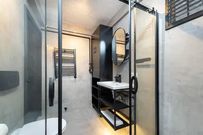 a bathroom with a sink and a shower at G&B MANSION in Istanbul