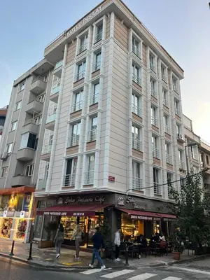 a large building with people walking in front of it at G&B MANSION in Istanbul