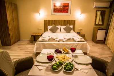 a hotel room with a bed with a tray of food on a table at Berlin Hotel Nisantasi in Istanbul