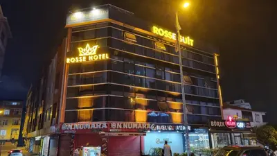 a hotel building with a sign on top of it at Rosse Hotel in Esenyurt