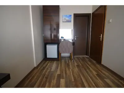 an empty room with a table and a chair at Venus Hotel Taksim in Istanbul