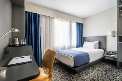 a hotel room with a bed and a desk with a desk at Misa Hotel in Istanbul