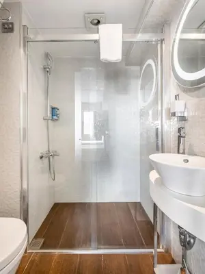 a bathroom with a shower and a toilet and a sink at Misa Hotel in Istanbul