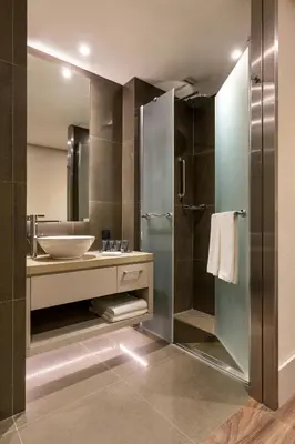 a bathroom with a sink and a shower at AC Hotel Istanbul Macka in Istanbul