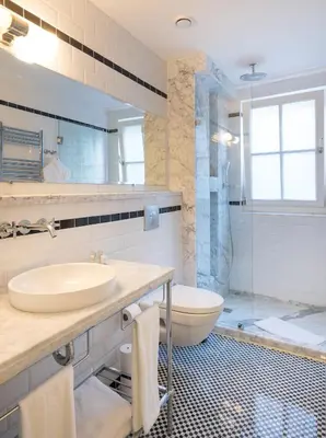 a bathroom with a sink and a toilet and a shower at Pera Neuf in Istanbul