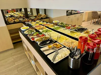a buffet line with many different types of food at Aram Edessa Hotel in Istanbul