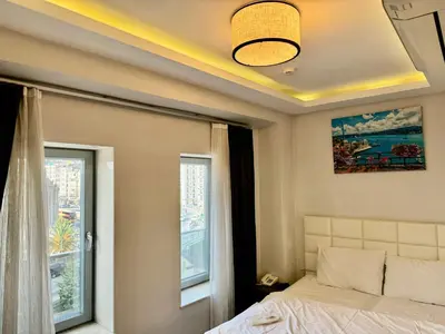 a bedroom with a bed and a window at Aram Edessa Hotel in Istanbul