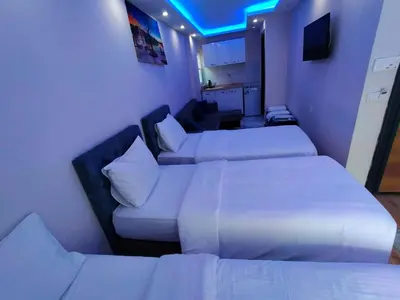 a hotel room with two beds and a couch at BlueRoyal Grand Bazaar in Istanbul