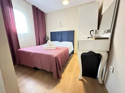 a hotel room with a bed and a mirror at Hagia Irene Old City in Istanbul