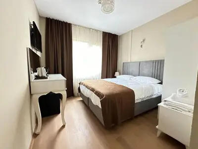 a hotel room with a bed and a window at Hagia Irene Old City in Istanbul