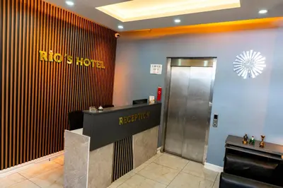 a hooters hotel lobby with a elevator at Rio's Hotel AİRPORT in Istanbul
