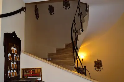 a staircase in a room with a mirror at Hotel Alp Guesthouse in Istanbul