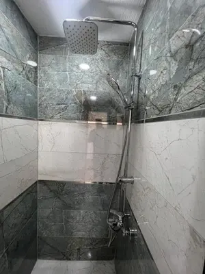 a bathroom with a shower with a glass door at Feycem Suites Hotel in Istanbul