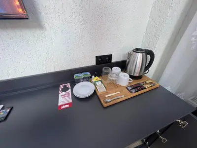 a table with a tray with a coffee maker on it at Feycem Suites Hotel in Istanbul