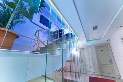 a glass staircase in a building with a potted plant at Parmada Hotel in Istanbul