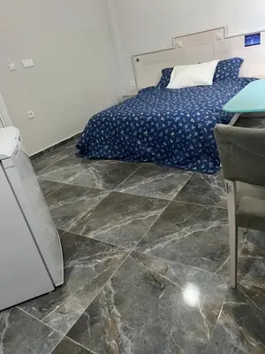a bedroom with a bed and a tiled floor at Zerya suites in Istanbul