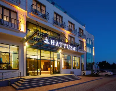 a hotel with a sign on the front of it at Hattusa Vacation Business Thermal Hotel Saray in Saray
