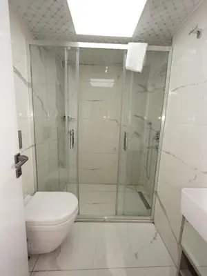 a bathroom with a shower and a toilet at gazelle suites in Istanbul