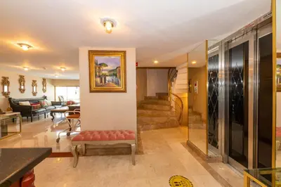 a living room with a couch and a staircase at Escardin hotel in Istanbul