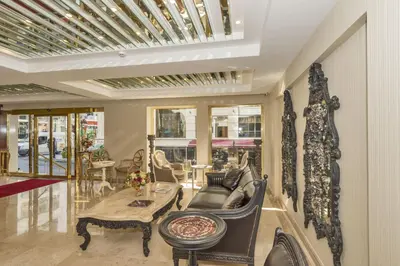 a living room with a table and chairs at Escardin hotel in Istanbul