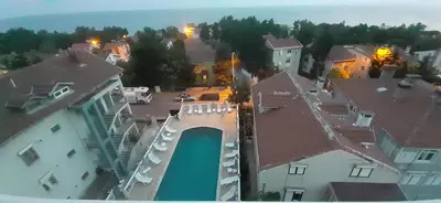 an aerial view of a city with buildings and a pool at SANCAK HOTEL in Buyukcekmece
