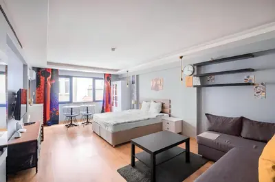 a living room with a bed and a couch at HANDMADE in Istanbul